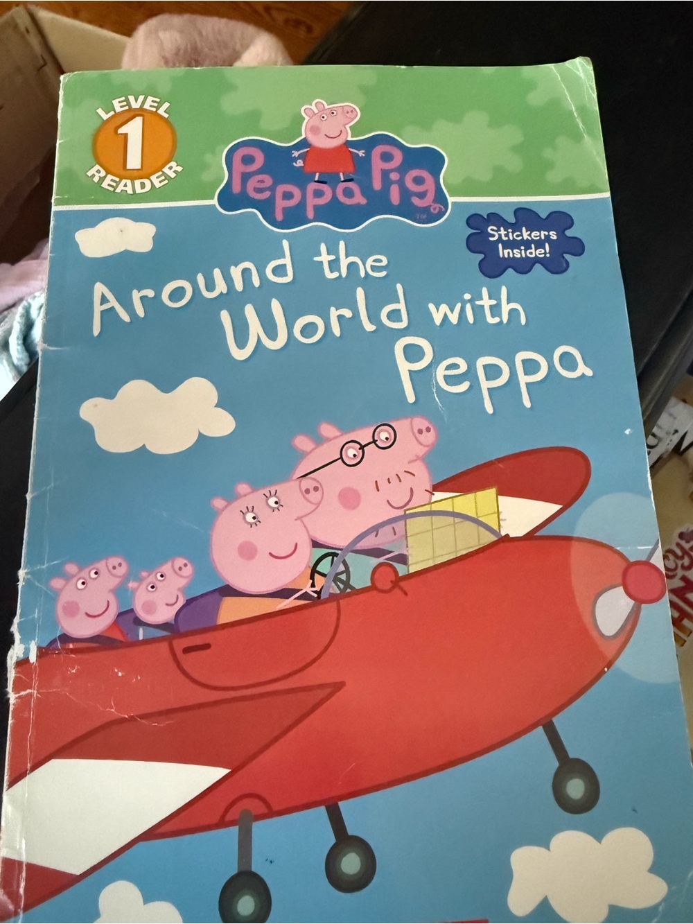 Scholastic Peppa Pig Around the World — Blue & Red Cover